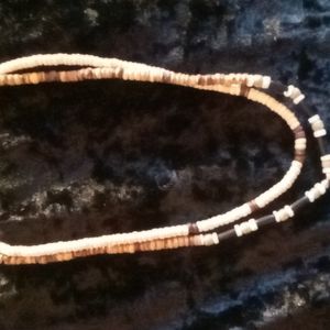 2 Shell and wood bead necklaces 18 inches long.